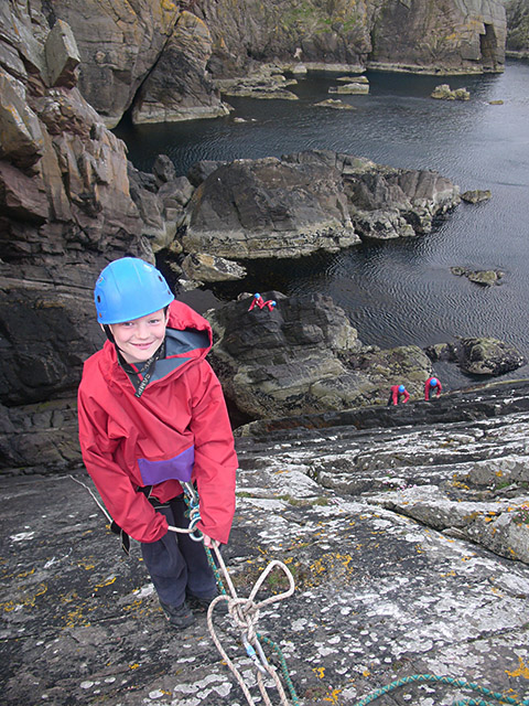 child with climbing rope